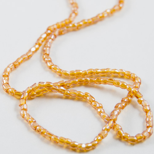 0107 12/0 3-cut bead iridescent gold yellow