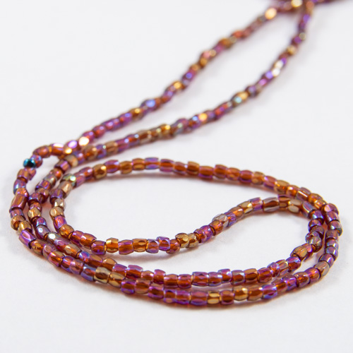 0283 12/0 3-cut bead ruby transparent iris