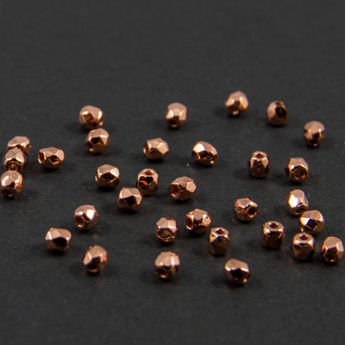 PR101. Perles cristal à facettes plaquées cuivre 2mm